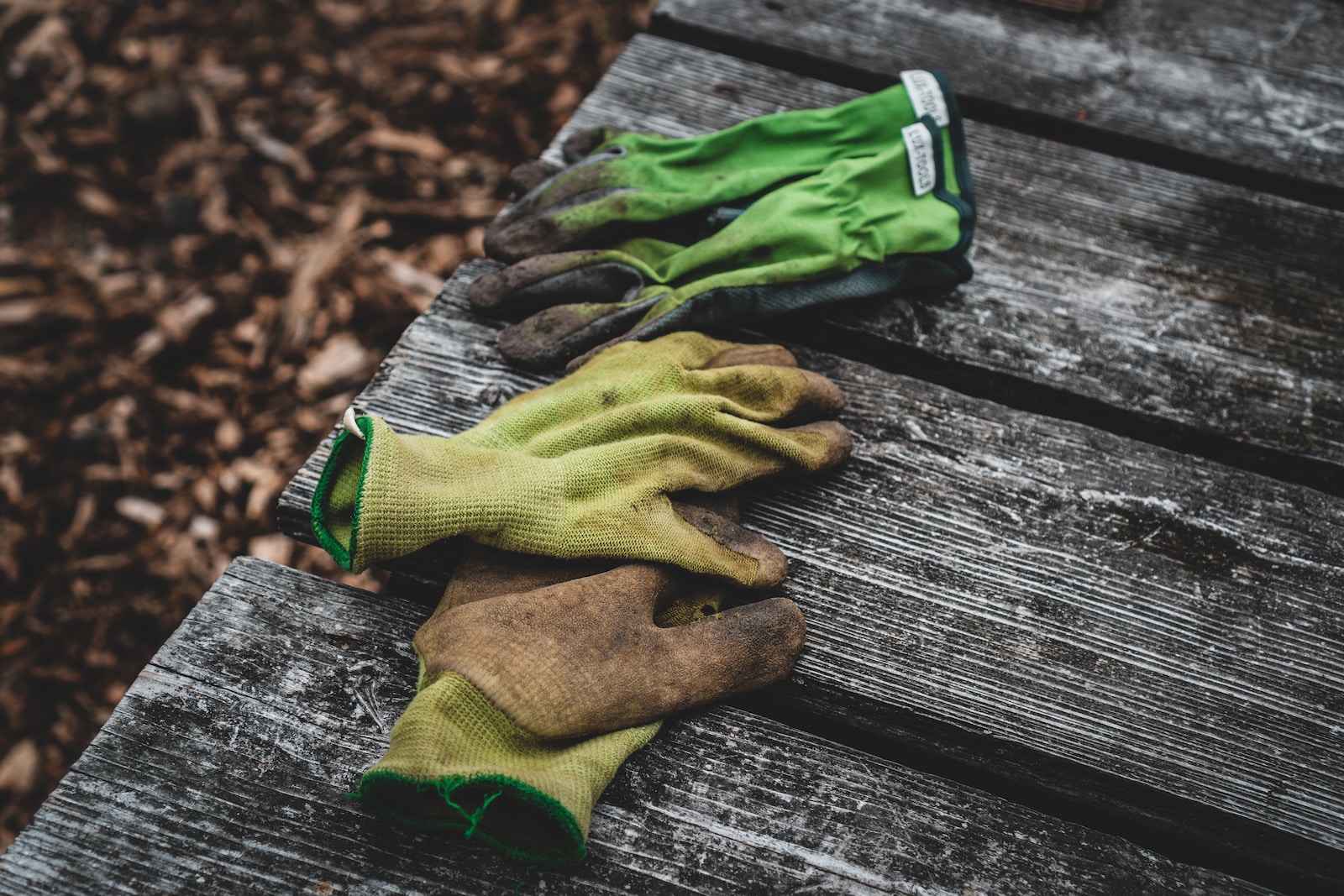 Photo by Jonathan Kemper brown and green sock on gray wooden surface
